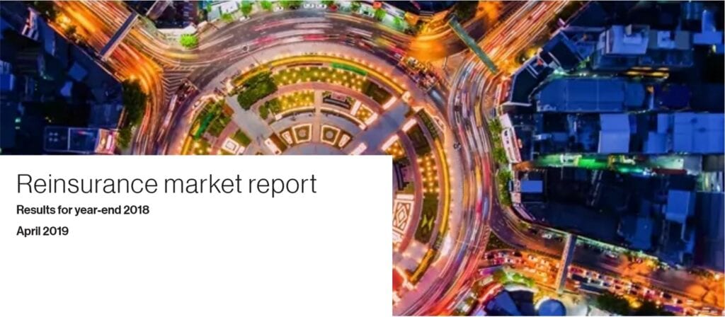 Aerial view of a brightly lit roundabout at night, surrounded by roads and buildings. On the left, a white overlay contains the text: Reinsurance market report, Results for year-end 2018, April 2019.