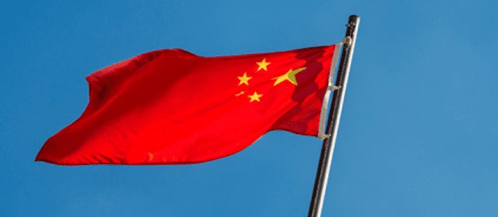 A red flag with yellow stars on it.