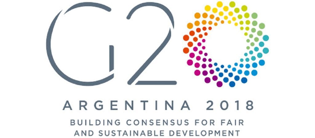 G20 Argentina 2018 logo with a colorful dotted circle, the text “ARGENTINA 2018” below, and the slogan “Building consensus for fair and sustainable development.”.
