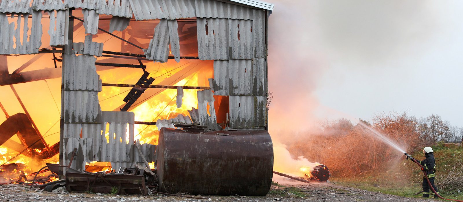 Burning farm building with hay