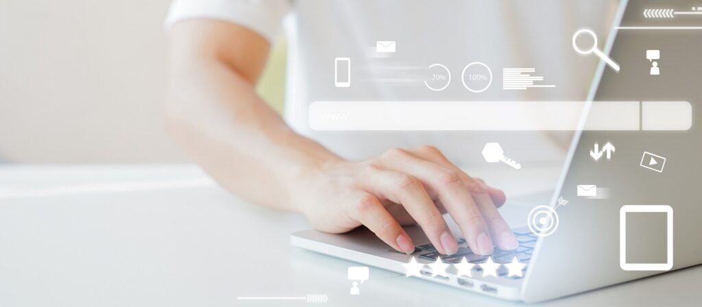 A person types on a laptop with digital search and internet icons overlaid, symbolizing online browsing and technology use in a bright, modern setting.