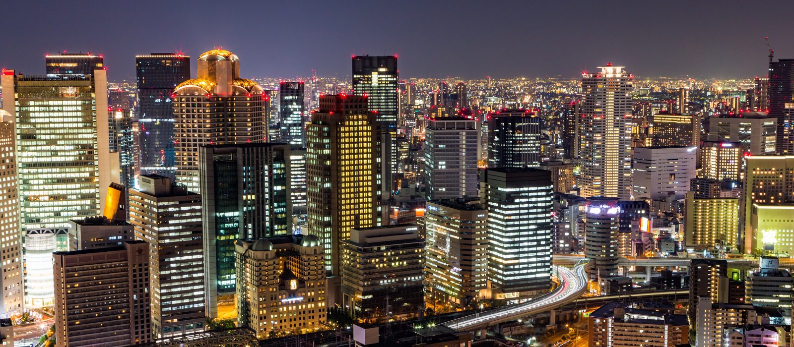 Osaka downtown skyline from Umeda sky building at night, Japan