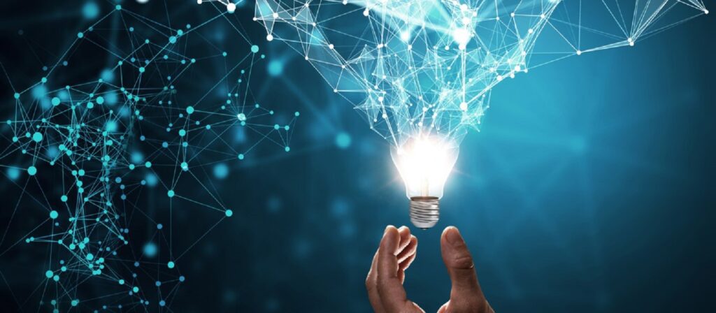 A pair of hands holding a glowing light bulb with interconnected blue lines and dots forming a network above it, symbolizing innovation, technology, and creative ideas.