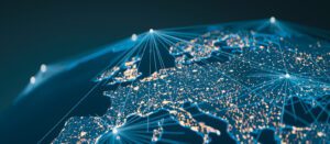 A digital illustration of Europe at night, showing glowing city lights connected by bright lines, representing global communication and data networks across the continent.