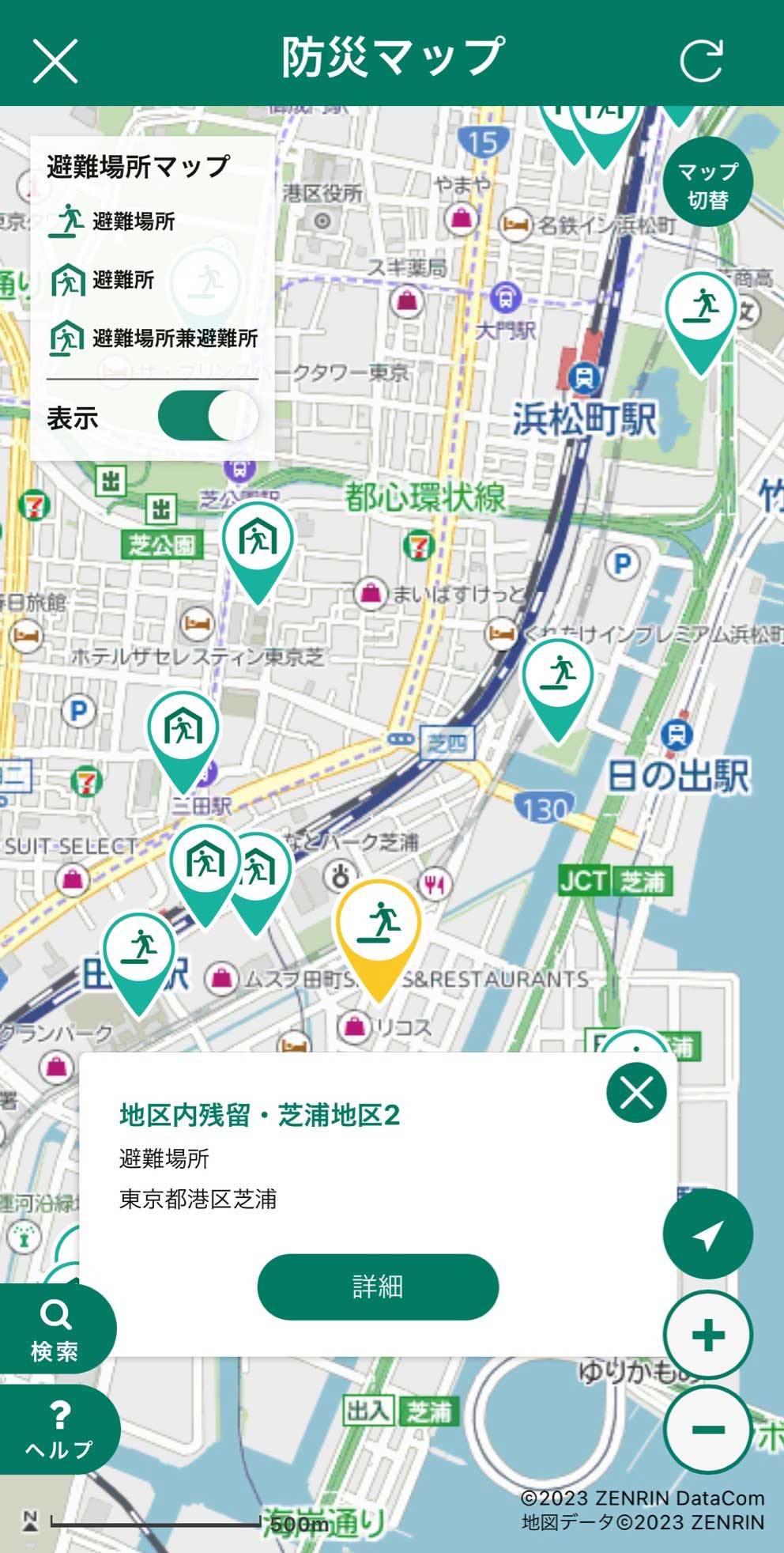 A Japanese disaster prevention map showing evacuation sites and routes near Hamamatsucho Station, highlighted by various icons on a city street map interface.
