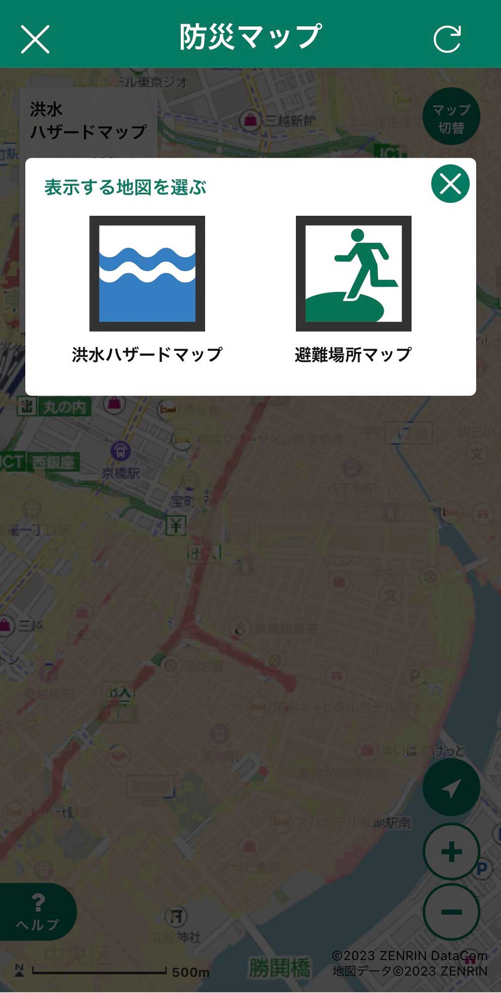 A Japanese disaster prevention map app screen showing options to display a flood hazard map (blue waves icon) or an evacuation shelter map (running person icon) over a city map background.