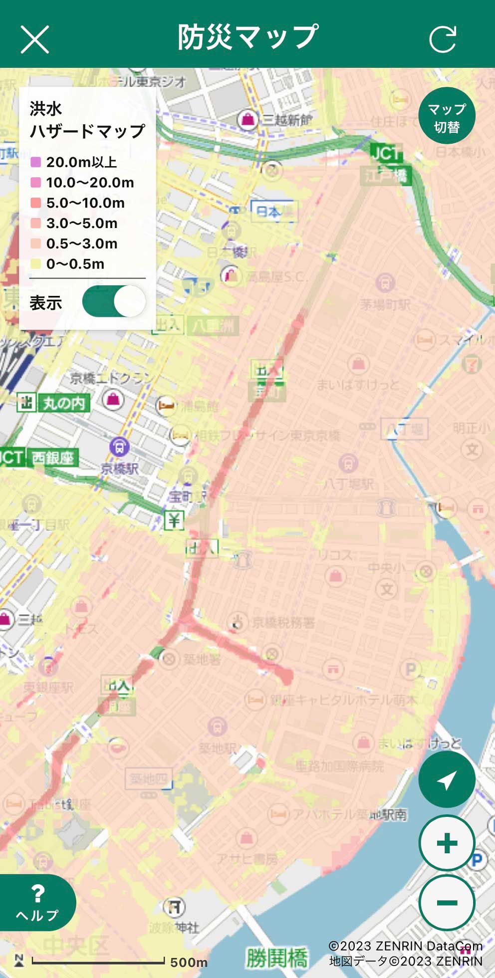 A Japanese hazard map showing flood depth risk areas in Tokyo, with color-coded zones from 0.5m to over 20m. Major roads, parks, rivers, and landmarks are displayed. The map is labeled in Japanese.