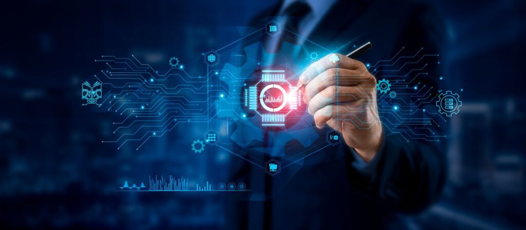 A person in a business suit uses a stylus to interact with a virtual touchscreen displaying a circuit-like interface and a gear icon, symbolizing technology, automation, and digital innovation.