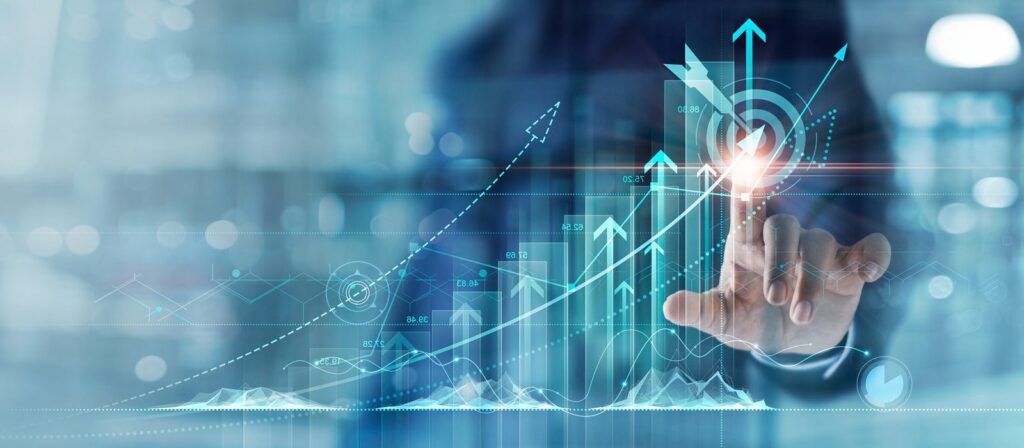 A person touches a virtual screen displaying upward-pointing arrows, bar graphs, and financial data, symbolizing business growth, success, and digital technology in a modern, futuristic setting.