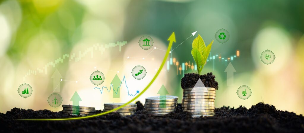 Stacks of coins with green seedlings growing from them, surrounded by eco-friendly and financial icons, symbolise sustainable growth, investment, and environmental responsibility. A yellow arrow and graphs indicate upward economic progress.