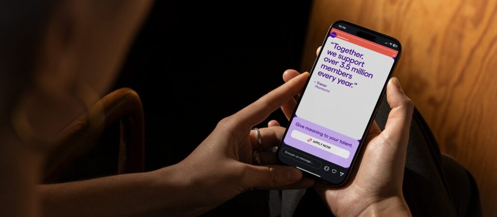 A person holds a mobile phone displaying an app with a message: Together, we support over 135 million members every year. The screen also has a button labelled Give recordings to your talent.